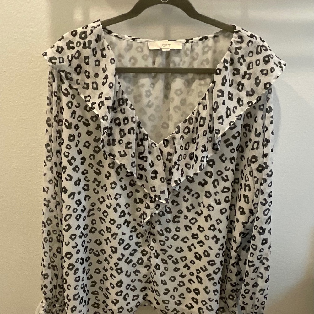 White and black ruffled animal print blouse